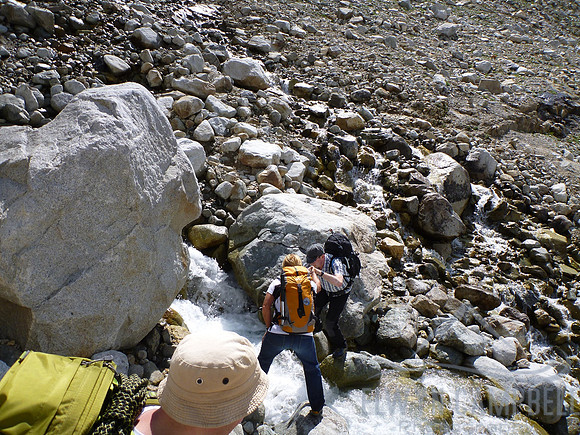 Crossing a stream near Kanderfirn Glacier